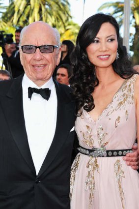 Media magnate Rupert Murdoch with former wife Wendi Deng. Prime ministerial aspirant Clive Palmer is furious about a story in Murdoch's Australian newspaper about the mining billionaire.