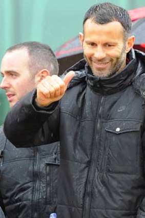 Ryan Giggs gestures during Manchester United's English Premier League winners parade in Manchester last week.