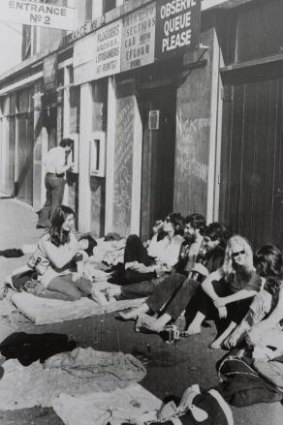 Fans queue outside the MCG, where David Bowie played in 1978. Among those seated in the queue is Sam Sejavka, second from left.