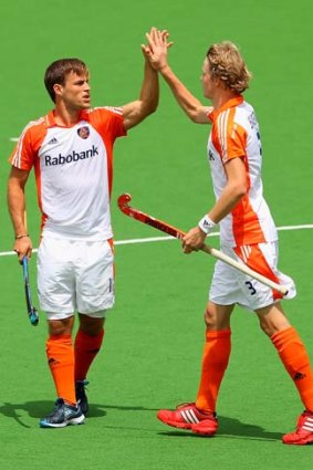 Orange aid: Jeroan Hertzberger and Tim Jenniskens celebrate.