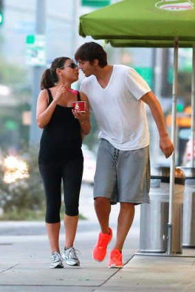 Kunis and Kutcher in June. The couple's first baby is expected at the end of August or early September.