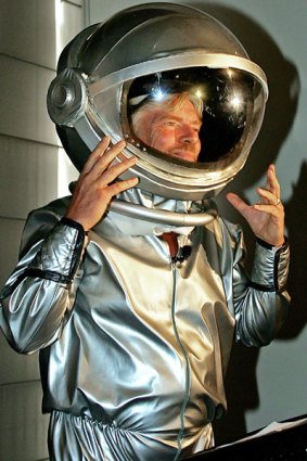 Richard Branson arrives in a space suit for the announcement in Sydney of Australia's first private astronauts to sign up for the Virgin Galactic flights into space.