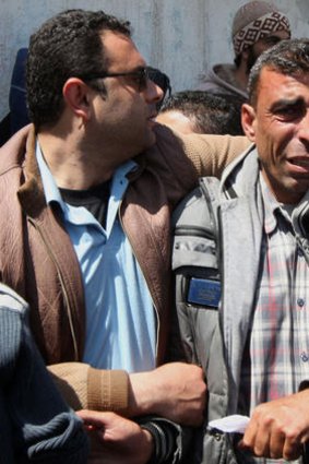 The father (right) of three Palestinian children who were killed.