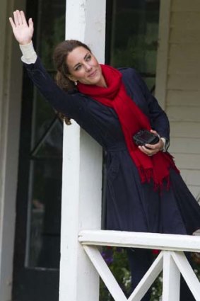 Catherine, Duchess of Cambridge, waves at her husband.