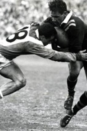Third test, 1960...Lionel Morgan fends off a French tackler. Dealing with homegrown bigots was a tougher affair.