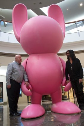 Brisbane Festival artistic director Noel Staunton and artist Stormie Mills welcome the first of a number of "bunnies", sculptures that will be popping up around town during this year's event.