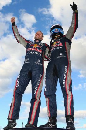 Sky's the limit: Title leader Jamie Whincup (right) and Paul Dumbrell acknowledge their win.