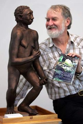 Sapiens meets Floresiensis: Mike Morwood with a model of his tiny find.