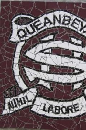 Queanbeyan High School Crest, done as a mosaic by kids at the school and erected above the stage in the hall.
