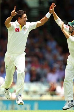 Mitchell Starc celebrates with Ed Cowan after bowling Jacques Kallis.