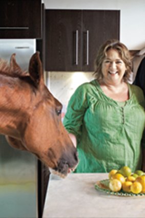 Animal house …  "It's like a circus here, with the pets" ... Richardson with wife Karen and Oscar the horse.