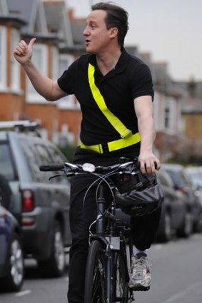 David Cameron cycling to work yesterday.