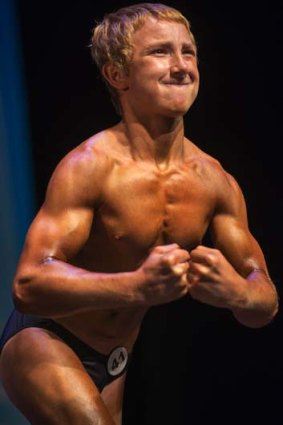 Flexing his muscles: Jake Schellenschlager at the 2013 Musclemania Capitol Tournament of Champions in May.