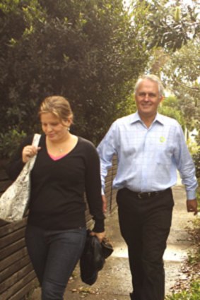 Striding back... a confident Malcolm Turnbull with daughter Daisy yesterday.