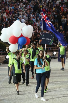 Flying the flag: the Australian team enters the stadium