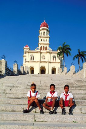 Island home ... schoolchildren at the city's Basilica del Cobre.