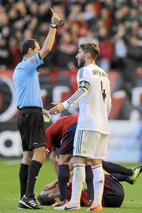 Off: Real Madrid star Sergio Ramos receives a straight red card against Osasuna at the weekend.