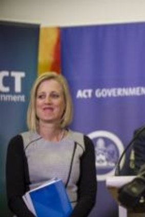 Shane Rattenbury will take over as ACT sports minister from Andrew Barr (in background).