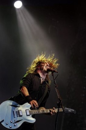 Foo Fighters lead singer Dave Grohl performs on stage at AAMI Park in Melbourne in 2011.