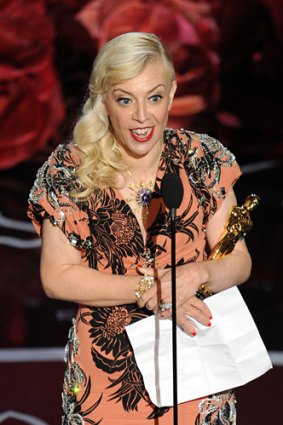 Australia's Catherine Martin accepts the Oscar for costume design.