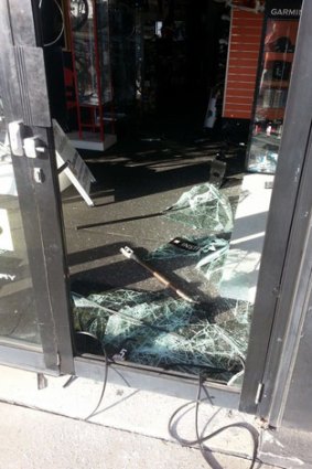 Thieves smashed through the front door of the Chain Gang shop on Seventeen Mile Rocks Road. Photo: Supplied.