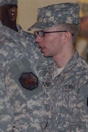 Bradley Manning is escorted from court by military officials.