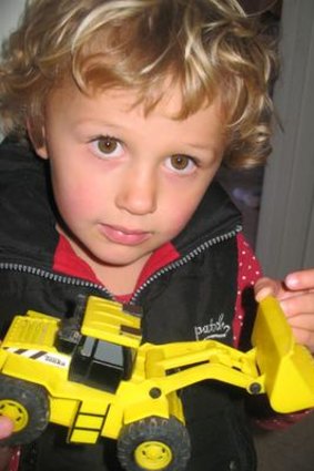 Quinlan, 3, with a toy digger, a fraction of the size and cost of the $20,000 Kobelco digger she won in a Trade Me auction.