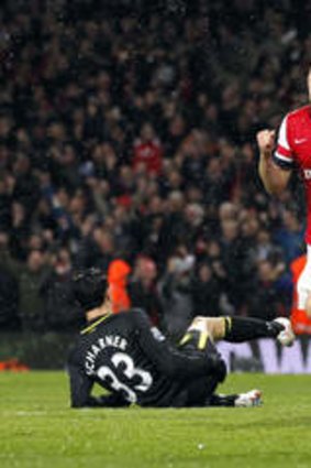 Arsenal midfielder Aaron Ramsey celebrates scoring his team's fourth goal.