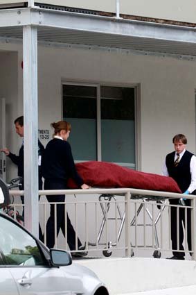 A body is carried from the Ashwood unit.