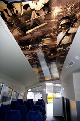 A photo montage inside "The Spirit Of Brisbane" shows workers cleaning up after the January floods.