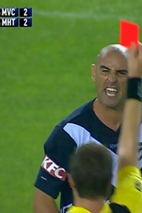 Melbourne Victory captain Kevin Muscat is show a red card for his horror tackle on Melbourne Heart's Adrian Zahra.