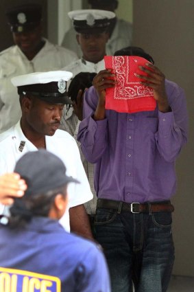 Keniel Martin  leaves the High Court of Antigua and Barbuda in St John's,  where he stands accused of the murder of  Ben and Catherine Mullany.