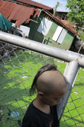 A street kid in Lok 1, one of the most dangerous areas of the slum.