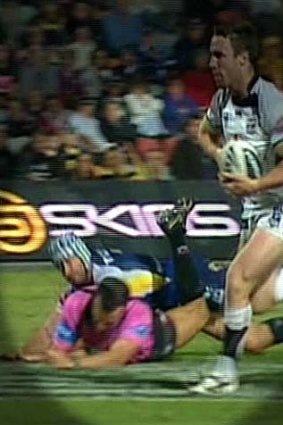 Didn't see it coming ... referee Matt Cecchin and Johnathan Thurston collide.