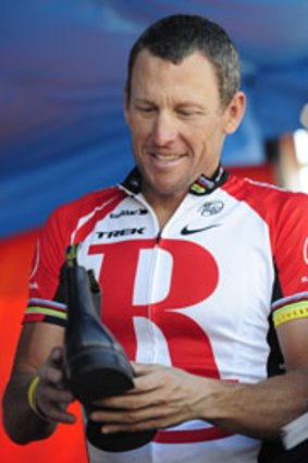 Final prize ... Lance Armstrong receives a gift.