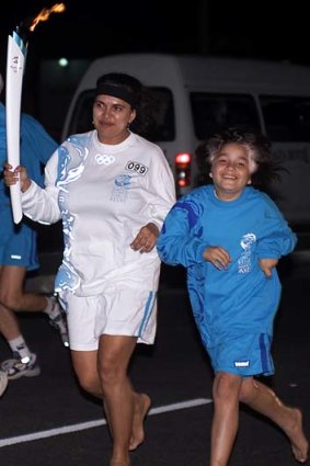 The Sydney 2000 Olympic Torch Relay journeyed through Cairns where Tjandamurra O'Shane joined his torchbearer mum Jenni Patterson.