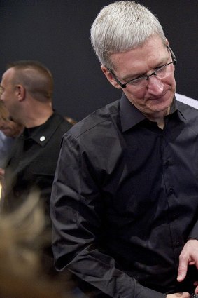 Tim Cook talks with Walt Mossberg at the launch of the iPhone 5 in 2012.