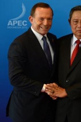 Australia's Prime Minister Tony Abbott is welcomed by Indonesia's President Susilo Bambang Yudhoyono at APEC in 2013.
