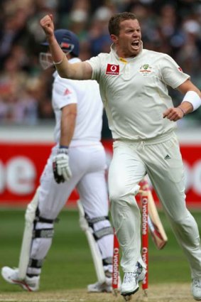 Peter Siddle celebrates the wicket of Andrew Strauss.