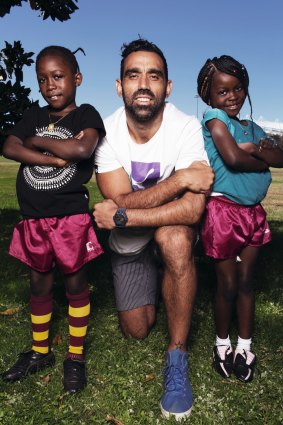 Jenovic Tubashiku, 8yo, with his sister Visca Tubashiku 7yo from the Congo, who were to become Australian Citizens on Australia Day 2014. With Sydney Swans player Adam Goodes who was named Australian Of The Year a week later.