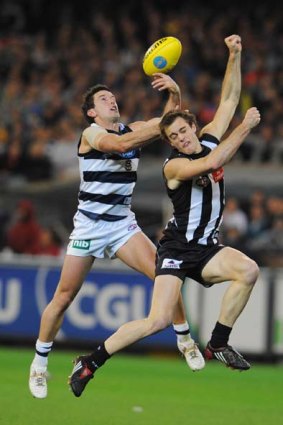 Preliminary Final, 2009. Geelong forward Shannon Byrnes competes with Collingwood defender Alan Toovey.