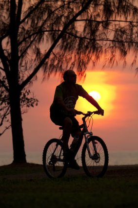 Mode share ... a cyclist at sunset.
