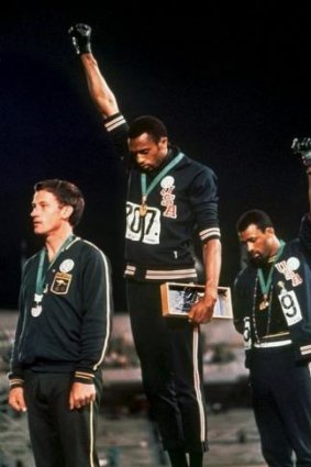 Powerful moment: Australia's Peter Norman (left) joins American athletes Tommie Smith and John Carlos on the podium during the famous "Black Power" demonstration.