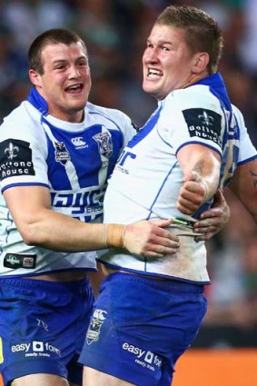 Fighting fit &#8230; Josh Morris grabs Greg Eastwood after the Bulldogs lock's try sealed last week's preliminary final win over South Sydney.