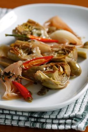 Braised artichokes with onions, olives and capers.