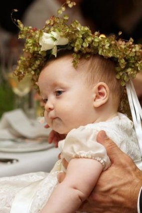 Baby Azura with her floral garland headpiece.