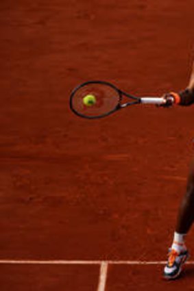 Serena Williams unleashes a forehand on her way to a straight sets win over Sara Errani.