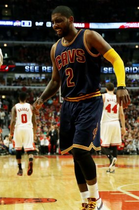 Kyrie Irving of the Cleveland Cavaliers reacts after being injured.