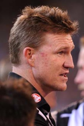 Nathan Buckley speaks to the team at quarter-time.