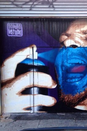 Australian street artist Damien Mitchell's work outside Brooklyn bar Levee.